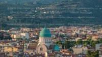 Synagogue of Florence timelapse with green copper dome rising above surrounding suburban housing
