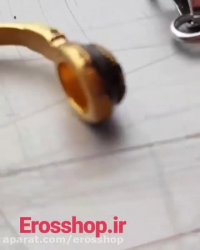 آویز طرح هدفون دارای رنگبندی سفید و طلایی erosshop.ir