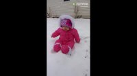 Baby experiences snow for the first time, has priceless reaction